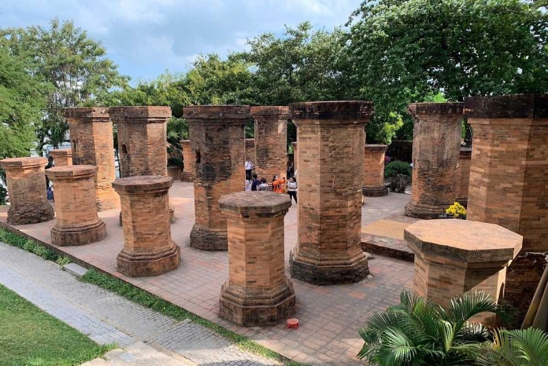 Cham Po Nagar Towers Pillars Ruins Nha Trang Ruins of ancient Cham Po Nagar Towers pillars with visitors exploring the heritage site in Nha Trang