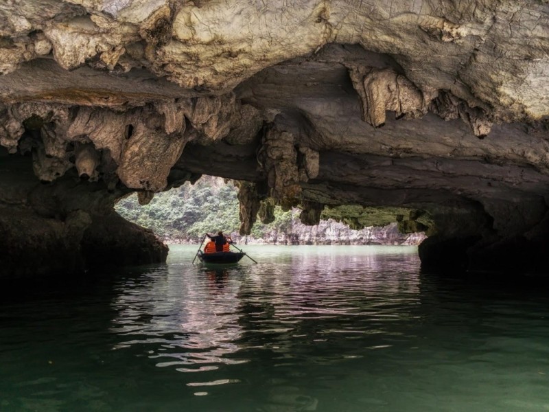 Exploring Trinh Nu Cave on a Bamboo Boat Exploring Trinh Nu Cave on a bamboo boat with serene waters and limestone formations