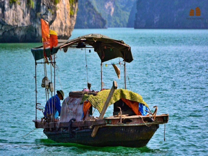 Fishing at Tung Sau Pearl Farm A fisherman casts his net near Tung Sau Pearl Farm, reflecting traditional fishing methods in Halong Bay.