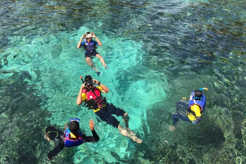 Group Snorkeling Adventure at Hon Mot Island Group of snorkelers exploring coral reefs and marine life together at Hon Mot Island near Nha Trang