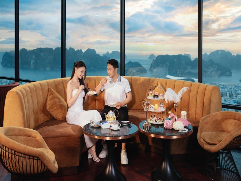 Ha Long Bay Luxury Resort Dinner Cruise Guests enjoy exquisite cuisine during a luxury dinner cruise in Ha Long Bay with stunning mountain views.