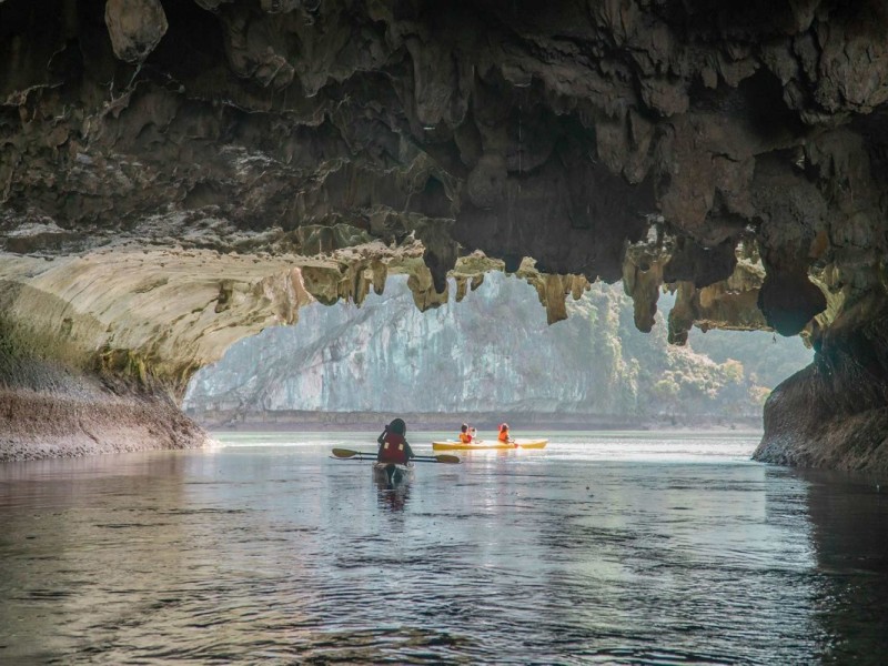 Kayaking in Bright Cave, Ha Long Bay Kayaking in the tranquil Bright Cave of Ha Long Bay