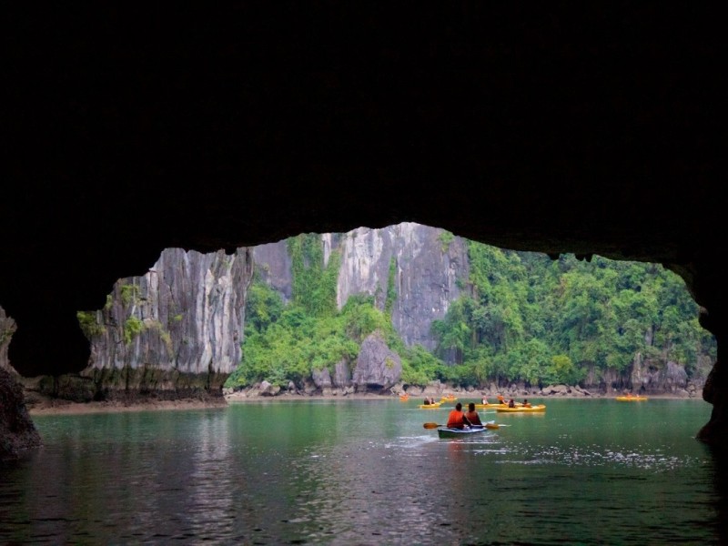 Kayaking Under Luon Cave Archway Paddling under the Luon Cave archway in Ha Long Bay