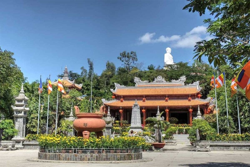 Long Son Pagoda temple complex overview Wide-angle view of the temple complex at Long Son Pagoda surrounded by lush greenery in Nha Trang