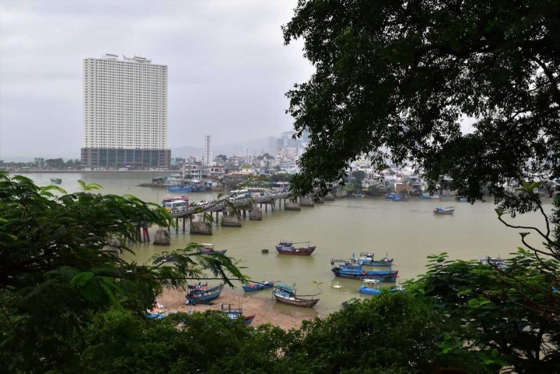 Panoramic View of Cai River and Nha Trang Panoramic daytime view of Cai River flowing through Nha Trang with boats and green spaces