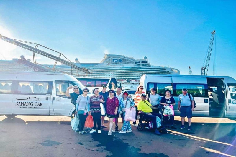Group of tourists boarding private transfer vans from Nha Trang City Centre to Cau Da Port Happy tourists boarding private transfer vans for journey from Nha Trang City Centre to Cau Da Port