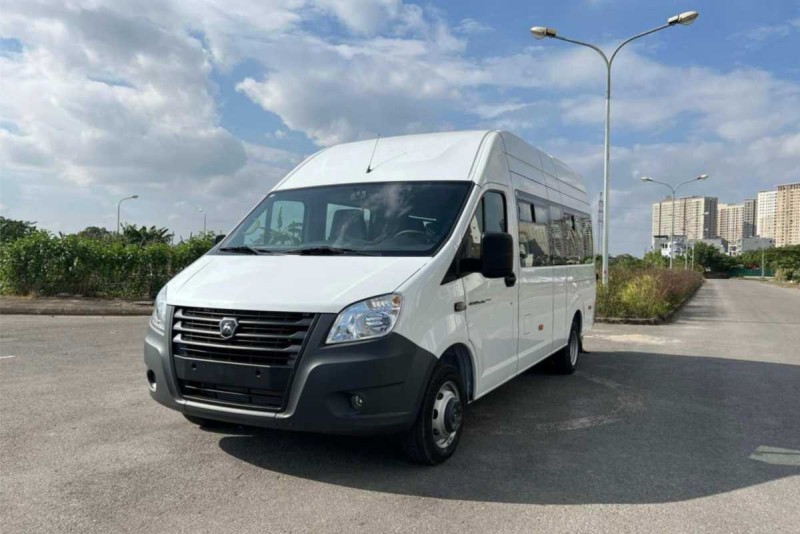 White passenger van ready for transfer from Nha Trang City Centre to Cau Da Port