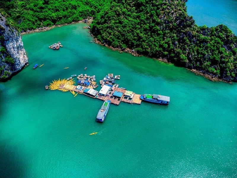 Tung Sau Pearl Farm in Lan Ha Bay A floating pearl farm surrounded by emerald waters in Lan Ha Bay, showcasing sustainable aquaculture.