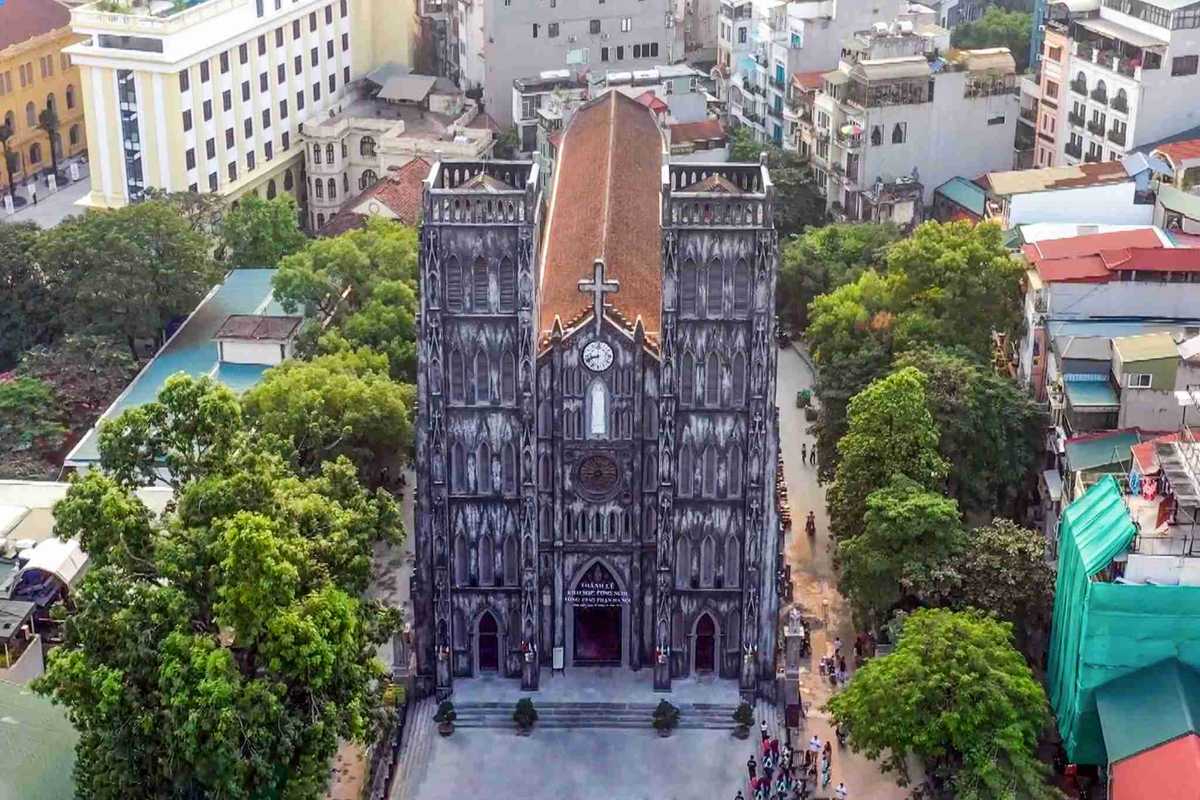 Arial View of St. Joseph’s Cathedral Hanoi Aerial shot of St. Joseph’s Cathedral Hanoi surrounded by trees and colonial buildings in the Old Quarter
