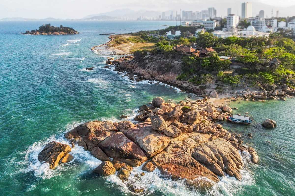 Aerial photo showing rocky landscape of Hon Chong Promontory surrounded by blue sea