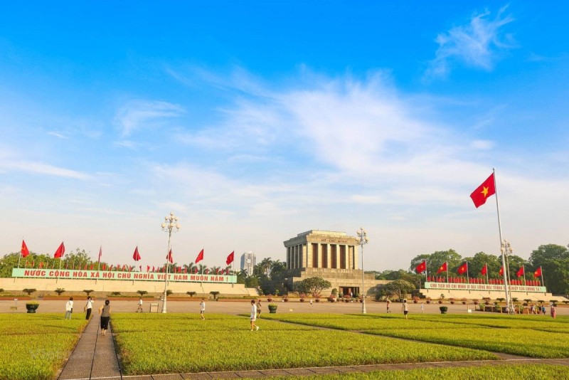 Ba Dinh Square and Ho Chi Minh Mausoleum – Vietnam’s Historical Heart Ba Dinh Square with multiple Vietnamese flags and the Ho Chi Minh Mausoleum in Hanoi