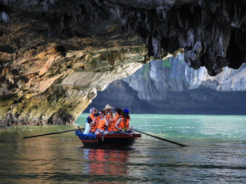 Bamboo Boat Tour Through Stunning Lagoons A bamboo boat touring tranquil lagoons surrounded by lush greenery.