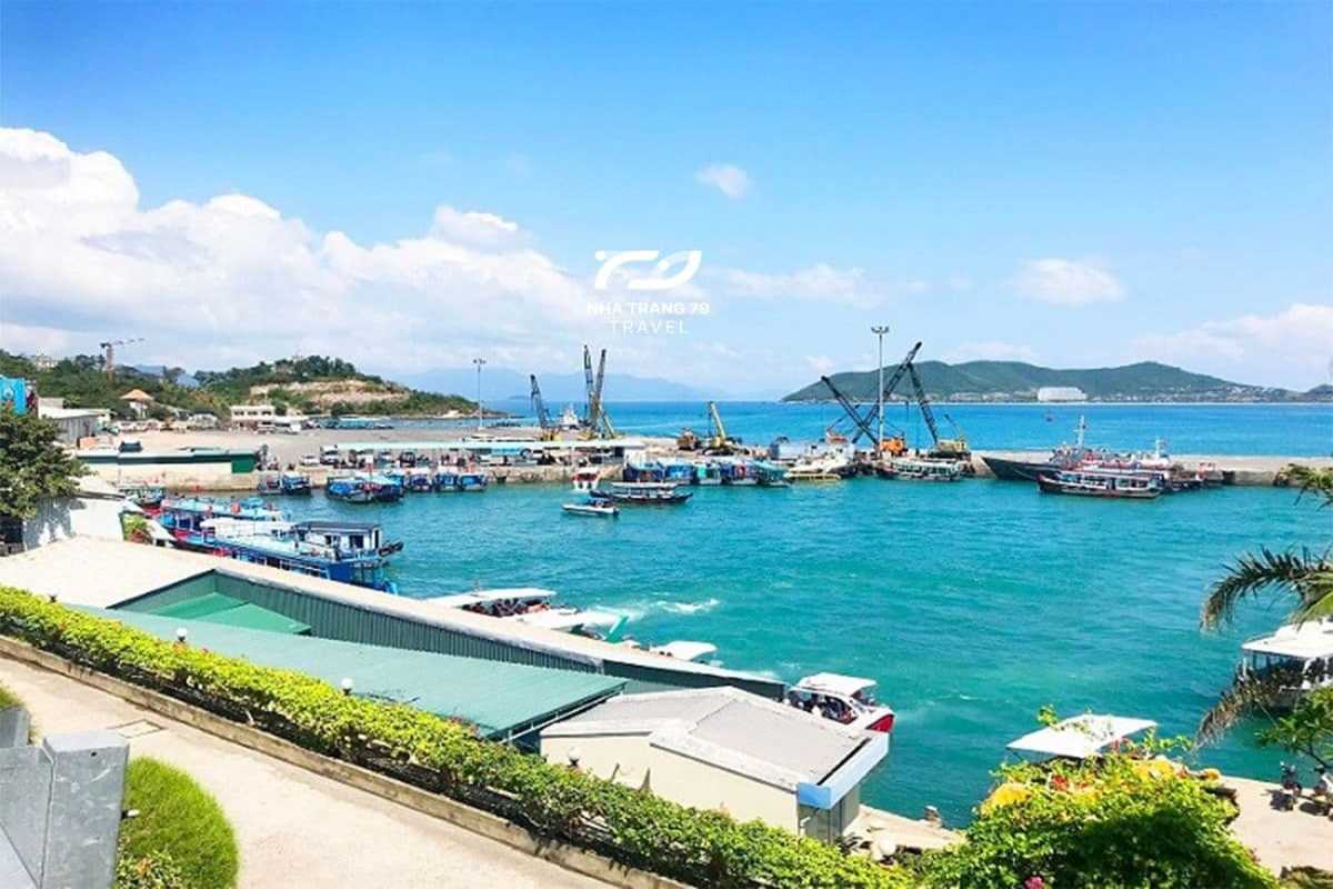 Pier with tour boats docked at Cầu Đá Pier in Nha Trang on a sunny day