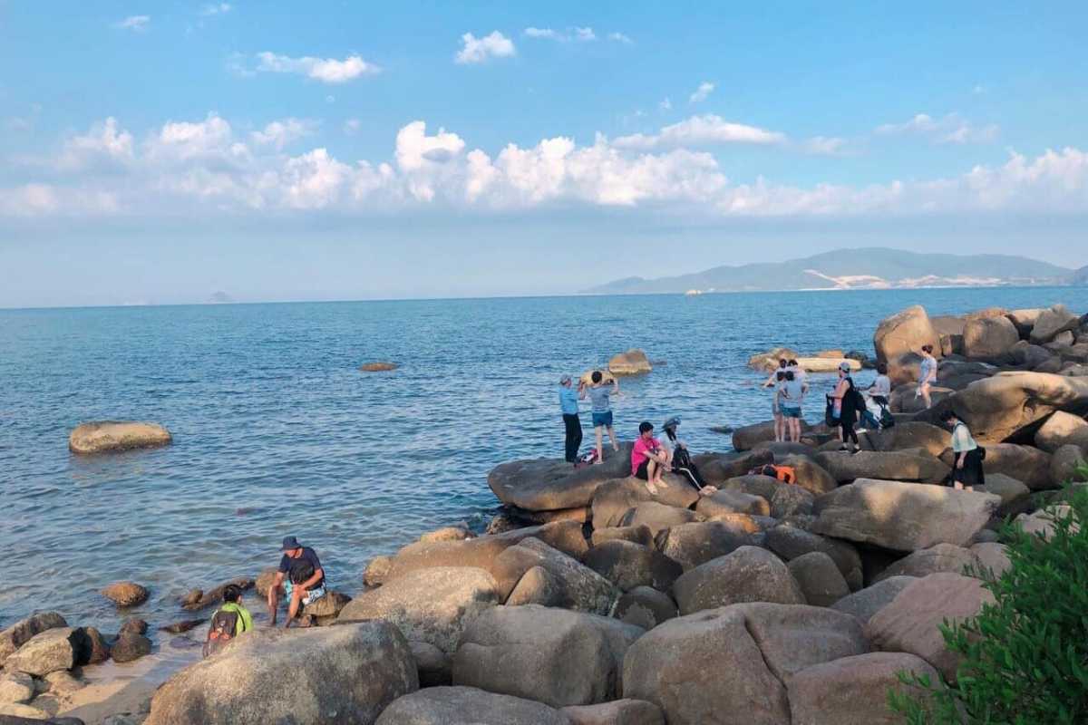 Clear blue waters surrounding granite rocks at Hon Chong Promontory in Nha Trang