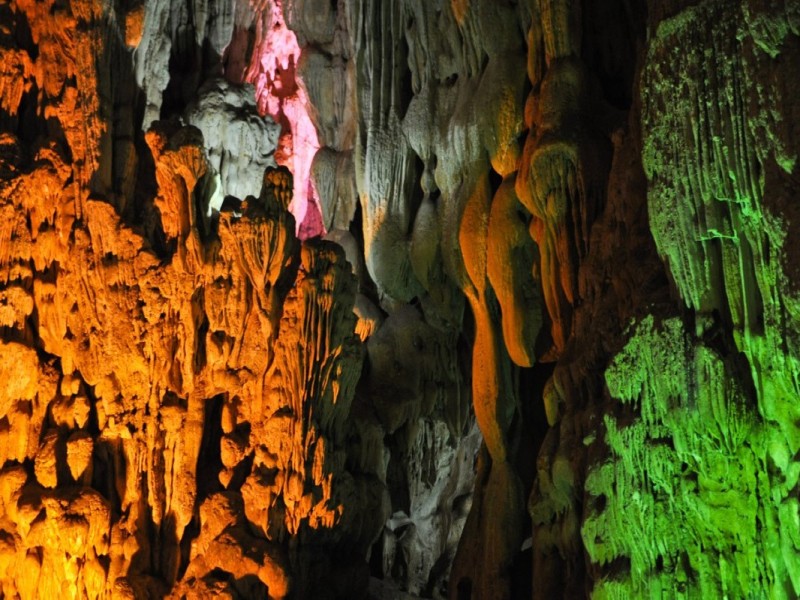 Colorful Limestone Stalactites Inside Trinh Nu Cave Close-up view of colorful limestone stalactites inside Trinh Nu Cave in Halong Bay.