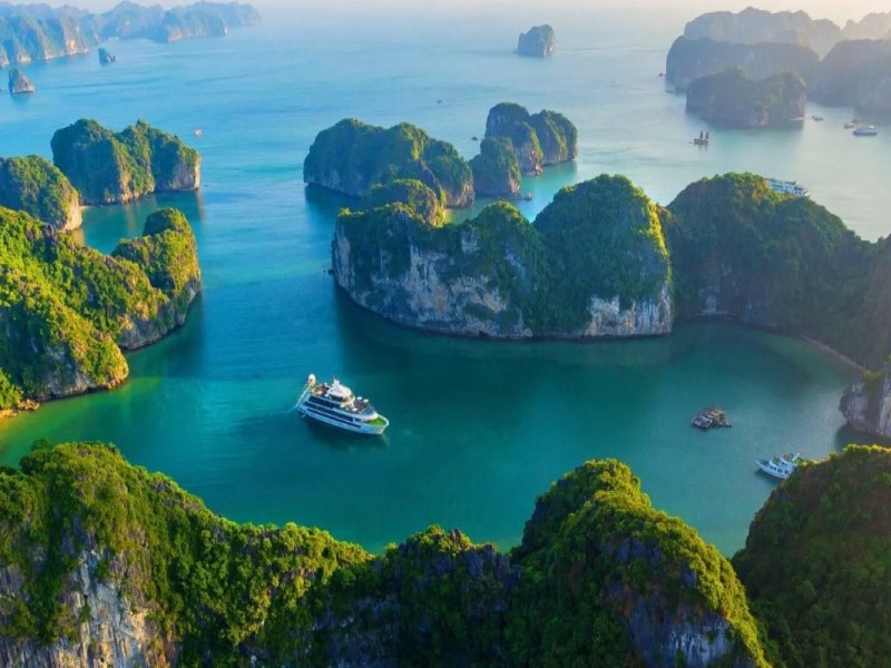 Cong Dam Area with Pristine Waters and Limestone Karsts Cong Dam Area in Bai Tu Long Bay with untouched waters, lush green islands, and limestone formations.