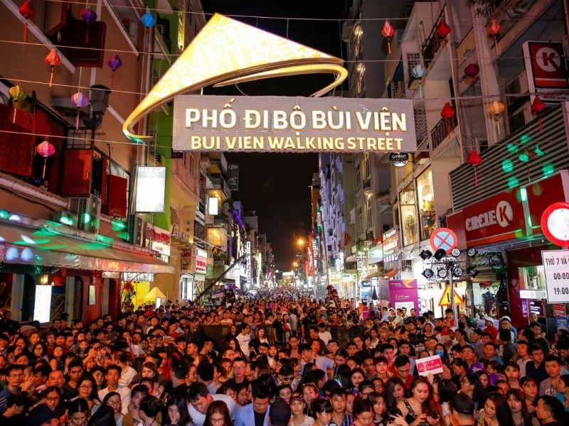 Crowds at Bui Vien Walking Street Entrance Dense crowd at the entrance of Bui Vien Walking Street