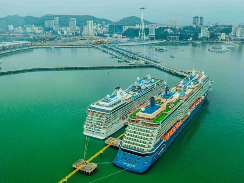 Cruise Ships and Cityscape at Halong International Cruise Port Cruise ships docked at Halong International Cruise Port with a view of the cityscape in the background.