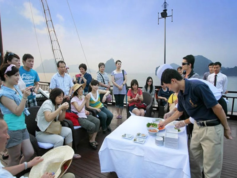 Culinary Workshop on Halong Bay Cruise Guests learning Vietnamese recipes on Halong Bay cruise.