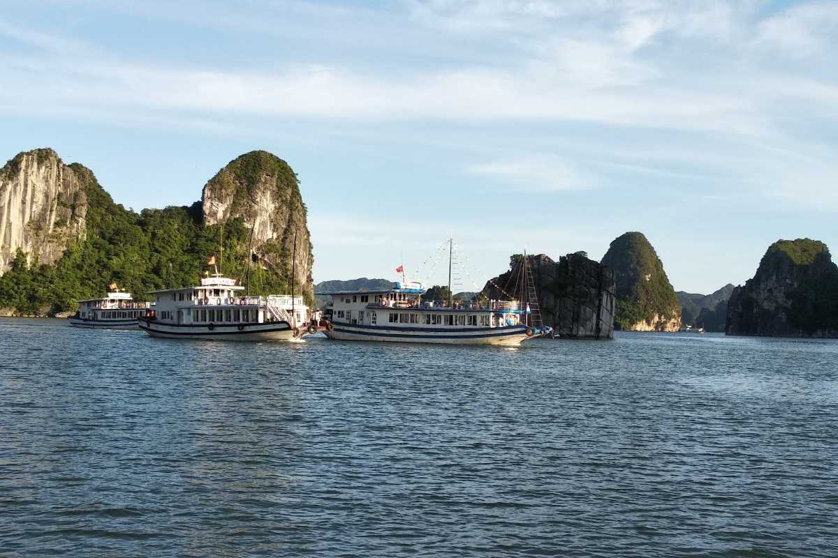 Distant limestone formation standing alone in Dinh Huong Islet Halong Bay waters