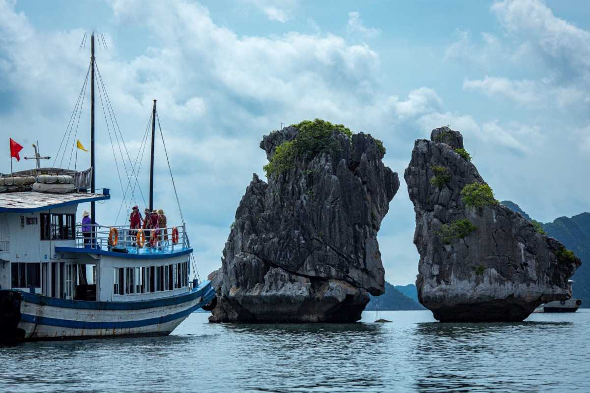 Close-up of limestone cliffs at Fighting Cocks Islet Halong Bay with green vegetation