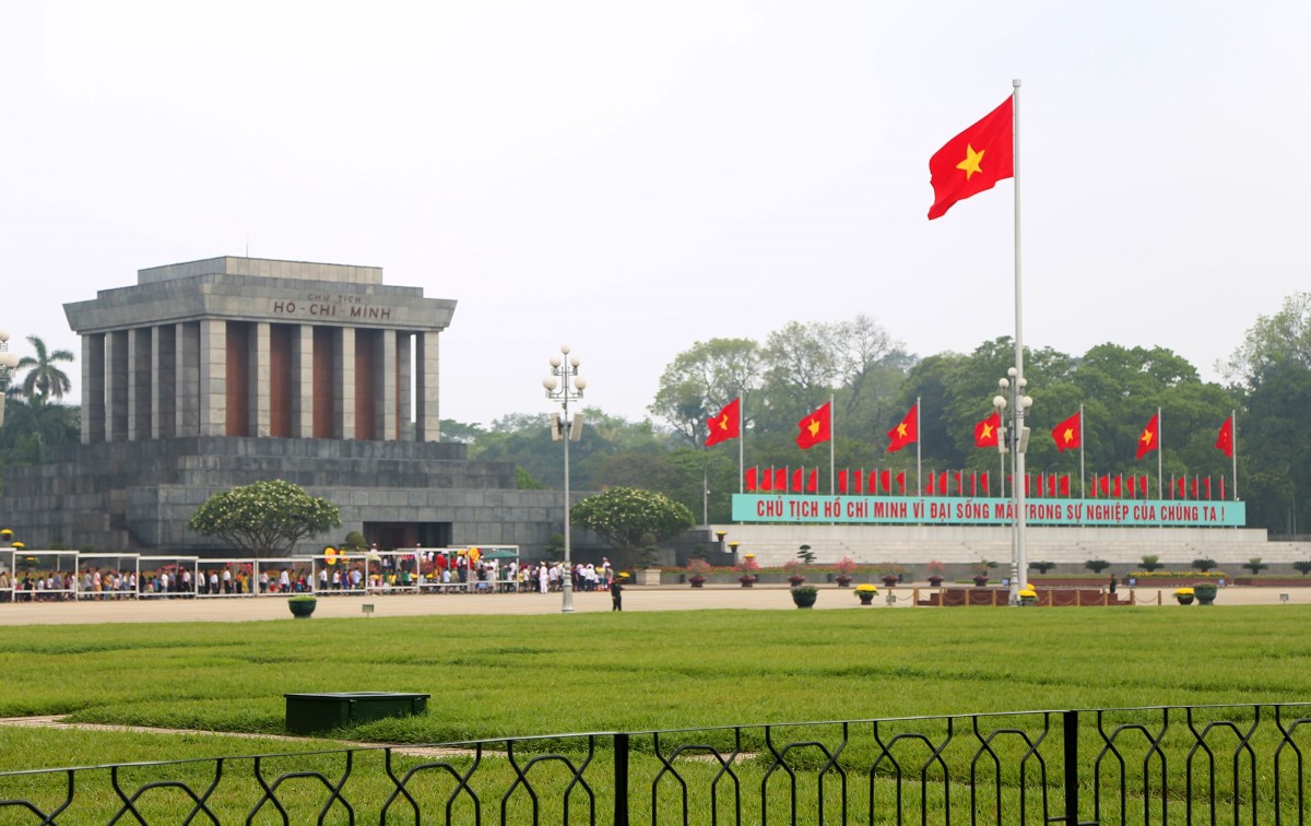 Flag Raising at Ba Dinh Square with Ho Chi Minh Mausoleum in the Background Ba Dinh Square flag raising ceremony with Ho Chi Minh Mausoleum in the background, Hanoi