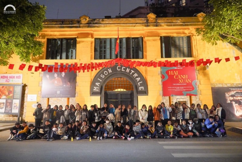 Front Entrance of Hoa Lo Prison (Maison Centrale) Group of visitors standing outside the entrance to Hoa Lo Prison, also known as Maison Centrale, in Hanoi.
