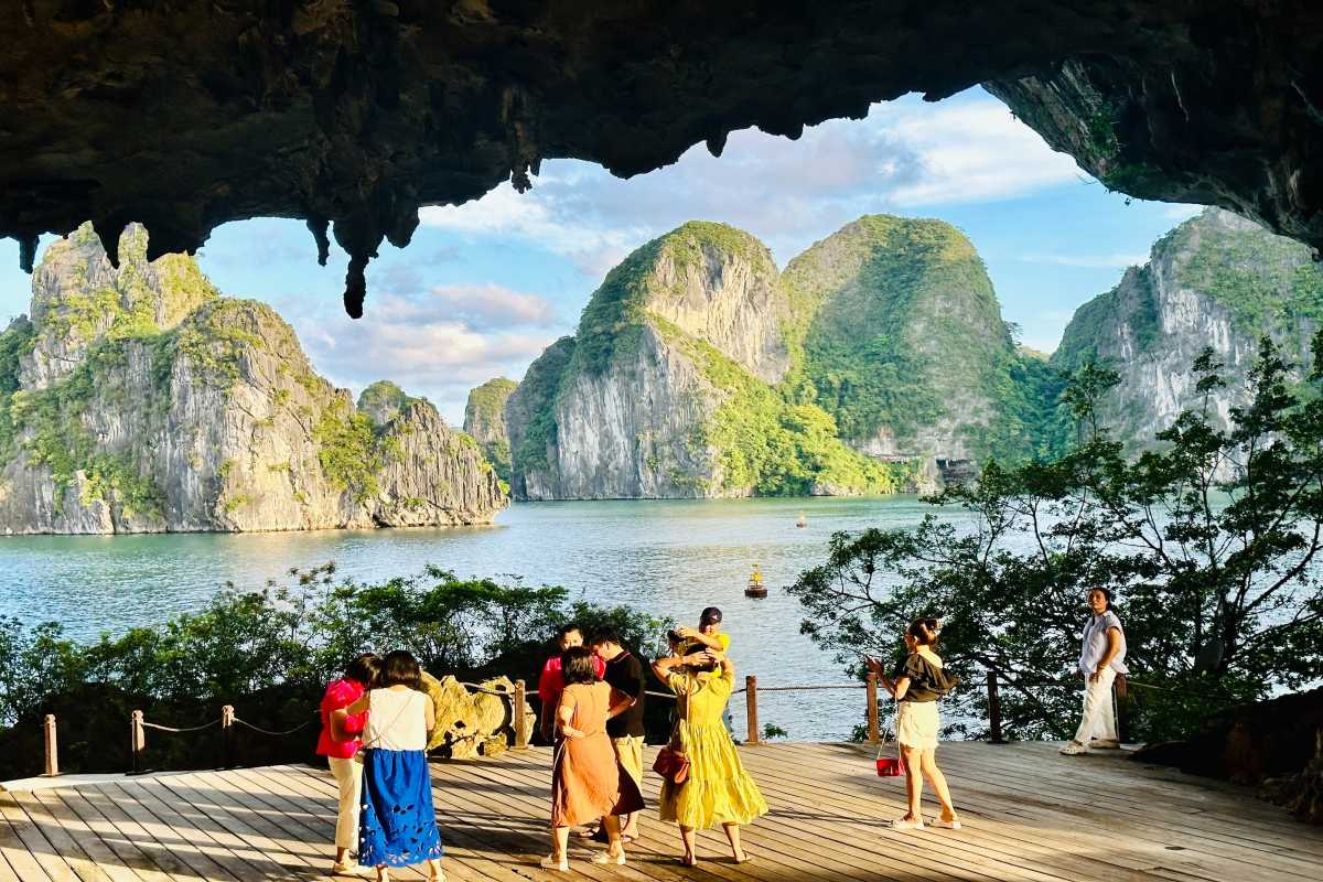 Traditional cruise boats sailing near Drum Cave Halong Bay, popular among tourists exploring the bay.
