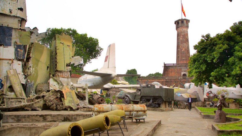 Hanoi Flag Tower and Military Exhibits Hanoi Flag Tower with military exhibits including planes and vehicles on display.