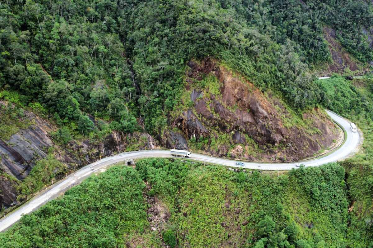 Sharp curves on Heaven Pass incline Truck and cars turning through narrow mountainous bends on Heaven Pass highway.