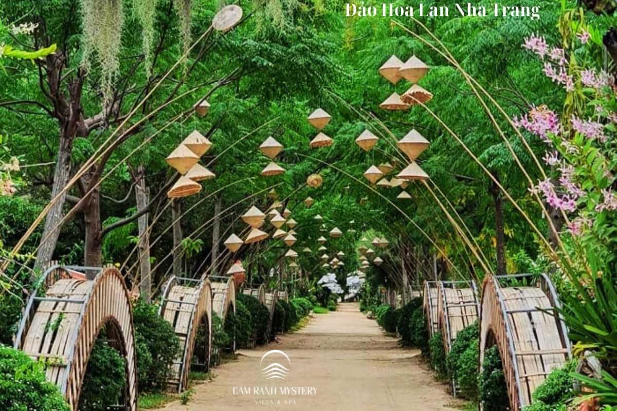Hoa Lan Stream Orchid Island Nha Trang Garden Walkway with Traditional Lanterns Peaceful garden walkway decorated with hanging traditional lanterns at Hoa Lan Stream Orchid Island in Nha Trang.