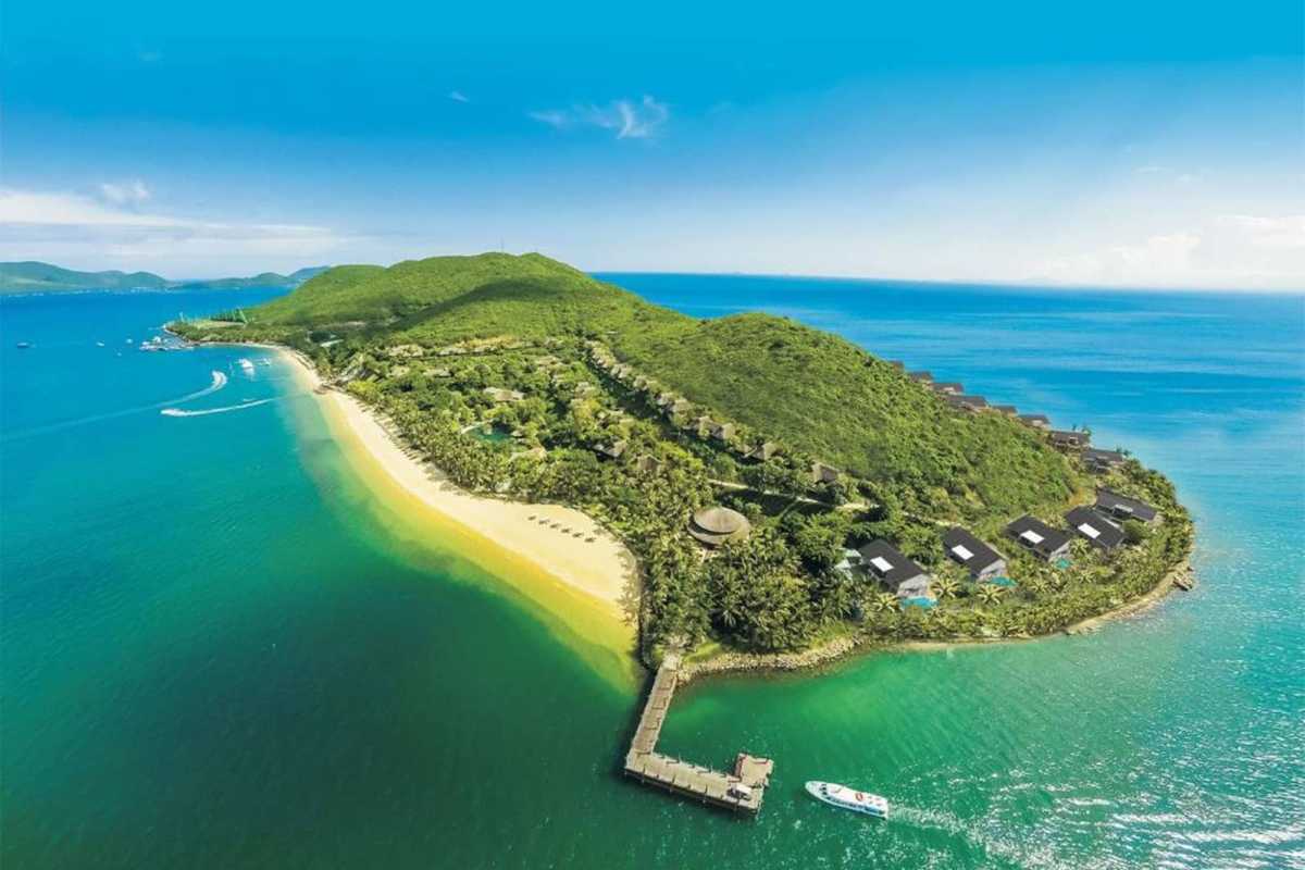 Panoramic aerial of Hon Tam Island’s green landscape and beaches near Hon Mot Island