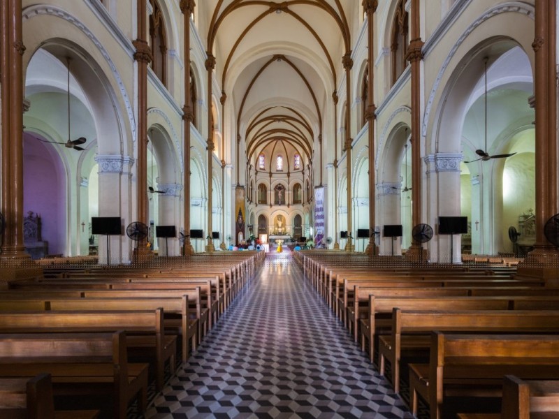 -Interior of Notre-Dame Cathedral Saigon Interior of Notre-Dame Cathedral Saigon with high arches and wooden pews