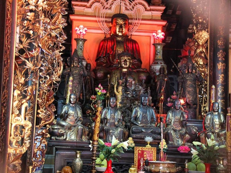 Intricate Altar of Giac Lam Pagoda Intricate Buddhist altar with statues and ornate decorations inside Giac Lam Pagoda