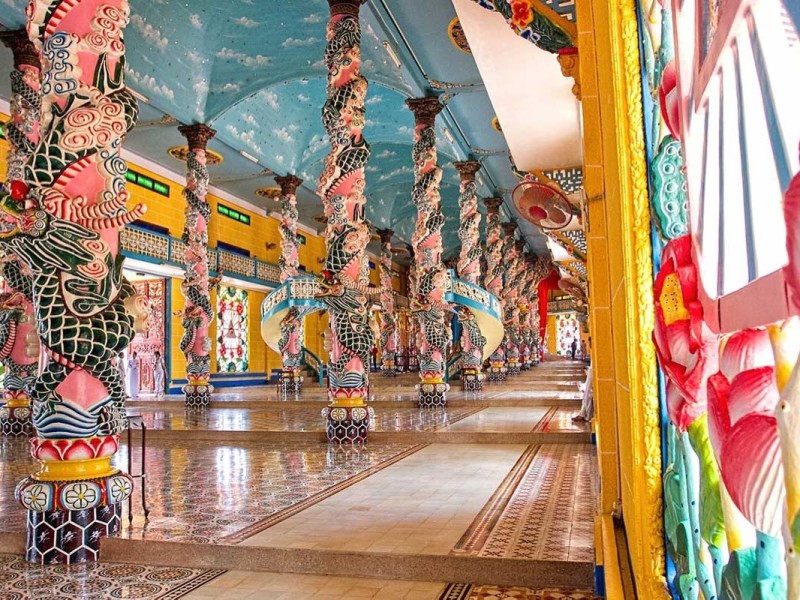 Intricate Dragon Pillars Inside Cao Dai Temple Intricate dragon pillars inside Cao Dai Temple showcasing traditional Vietnamese craftsmanship.