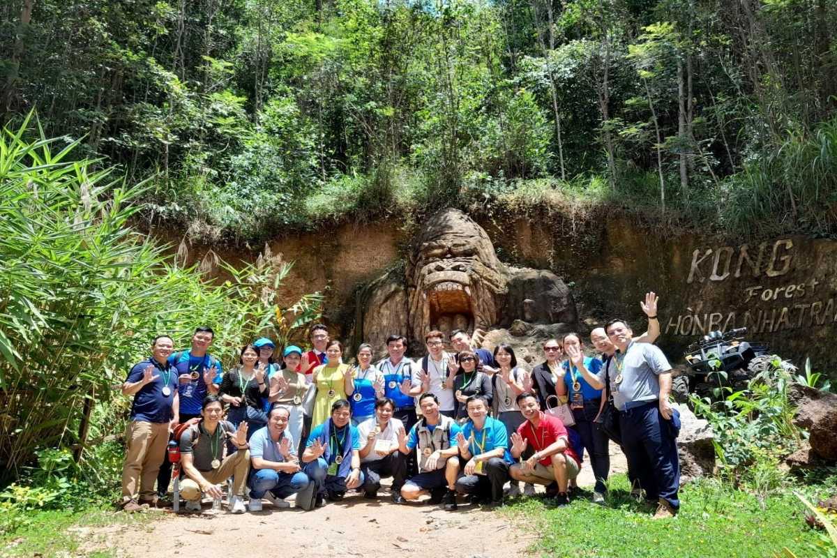Group of tourists wearing life jackets enjoying river rafting in Kong Forest, Hon Ba Nature Reserve