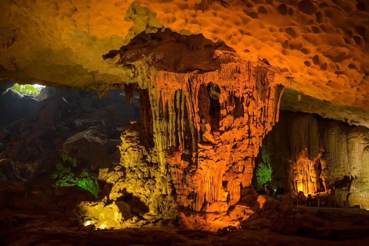 Huge, illuminated stalactite formation inside Sung Sot Cave Halong Bay, showcasing natural geological marvels
