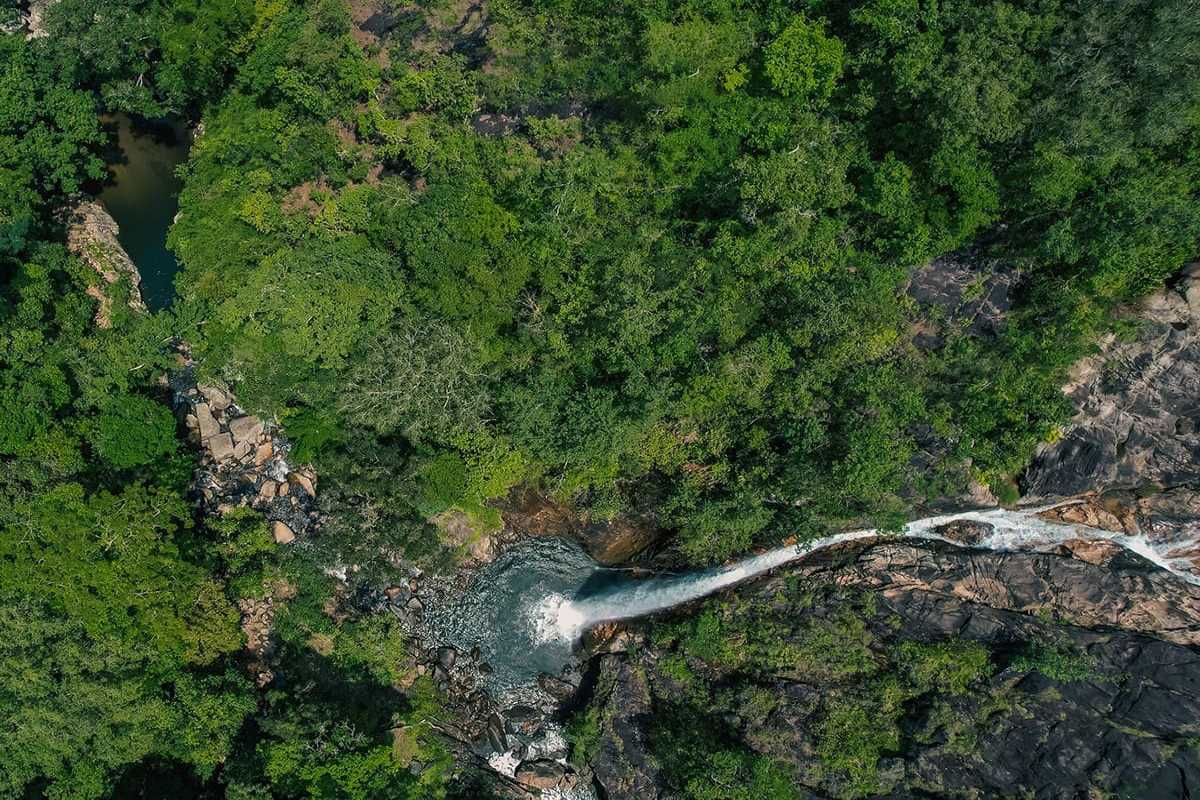 Waterfall cascading through dense forest in Hon Ba Nature Reserve Cam Lam