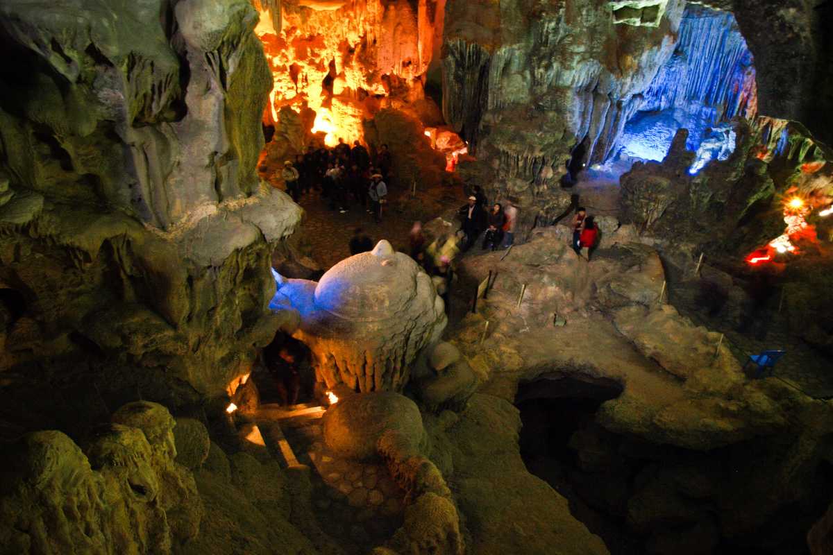 Illuminated rock pillars in Me Cung Cave Halong Bay create a stunning underground landscape