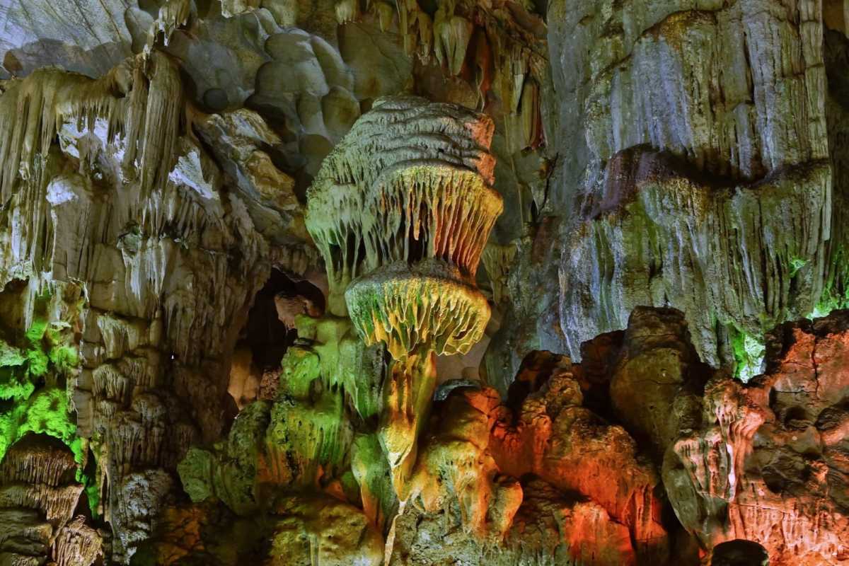Large limestone formations inside Me Cung Cave Halong Bay highlight the cave’s geological grandeur.
