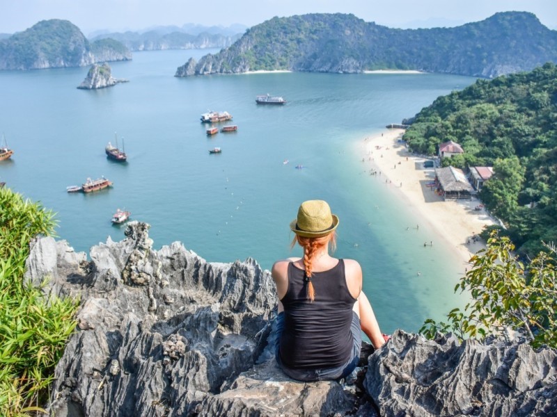 Monkey Island Viewpoint on Cat Ba Island Tourist overlooking the beach from Monkey Island viewpoint on Cat Ba Island