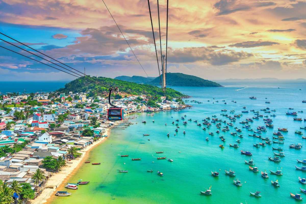 Aerial view of fishing boats and coastline at Nha Phu Bay Aerial view capturing hundreds of fishing boats moored along the coastline of Nha Phu Bay, highlighting local fishing culture and vibrant marine activity.