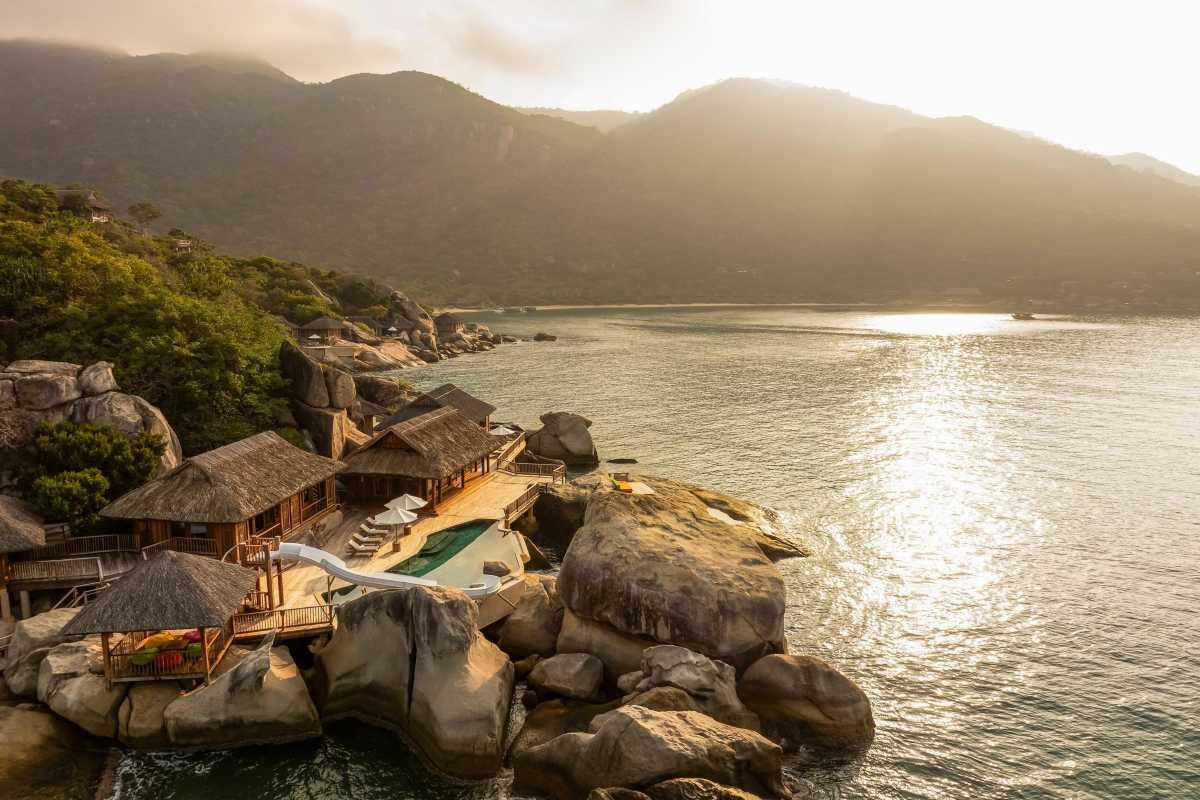 Sunset at Ninh Van Bay resort Golden sunset light over luxury resort and calm waters in Ninh Van Bay.