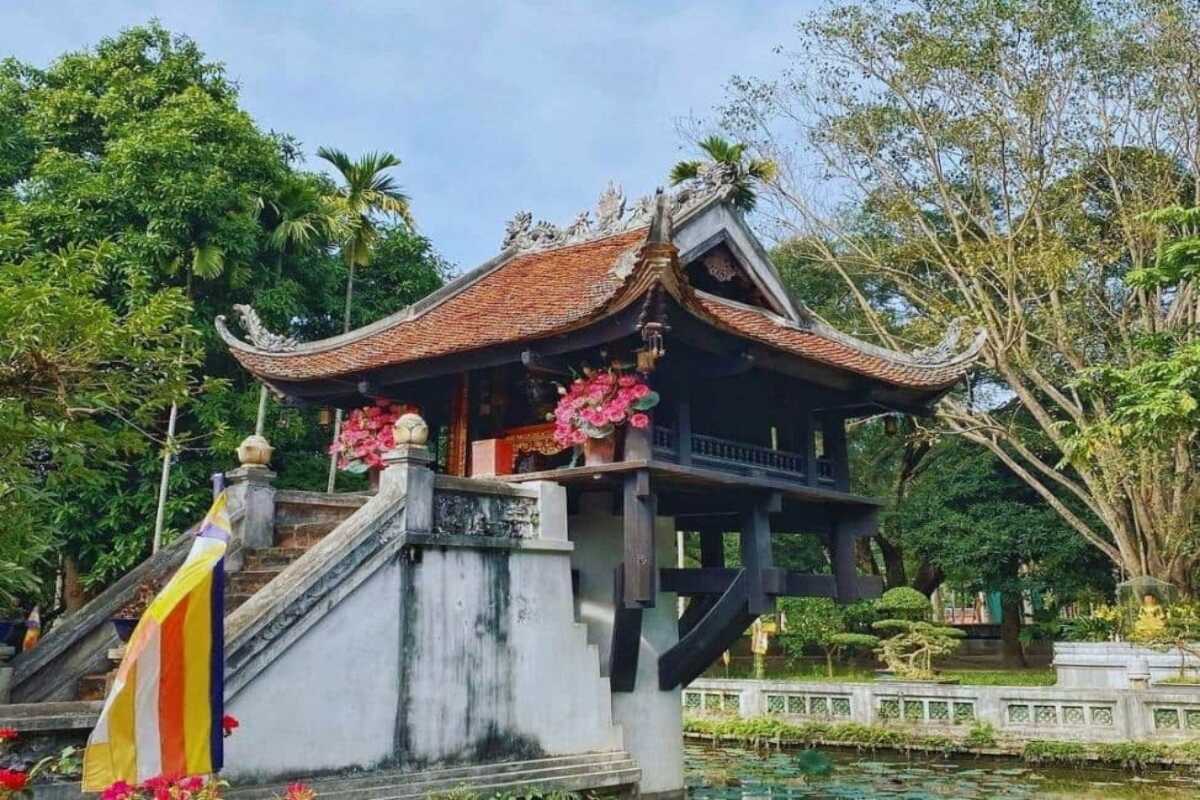 One Pillar Pagoda in Hanoi surrounded by lush trees and traditional architecture