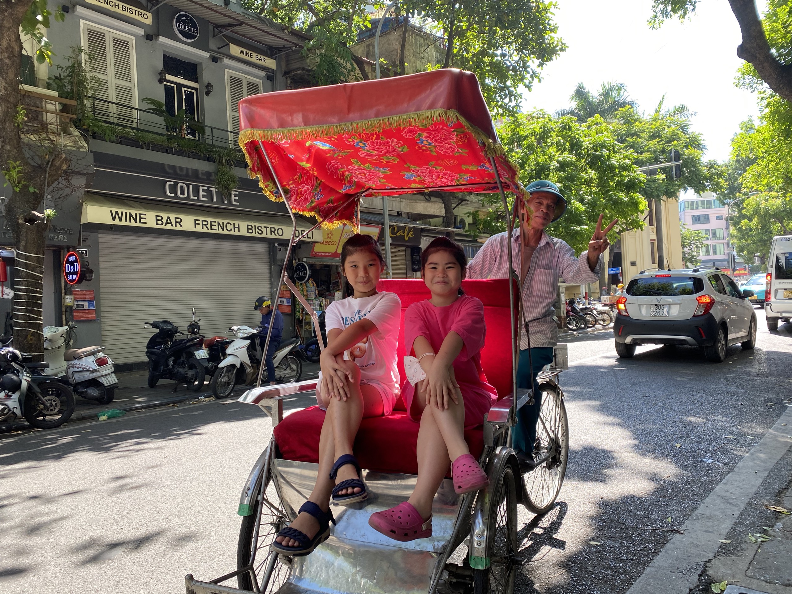 Private Cyclo Tour through Hanoi’s Old Quarter Two tourists enjoy a private cyclo tour through Hanoi’s Old Quarter with a local driver