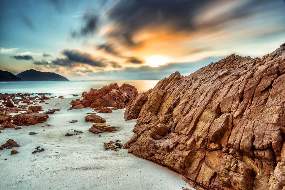 Rocky cliffs overlooking the ocean waves on Quan Lan Island