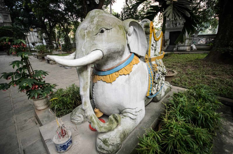 Sacred Elephant Statue at Quan Thanh Temple A stone elephant statue at Quan Thanh Temple, representing strength and protection in Vietnamese culture.