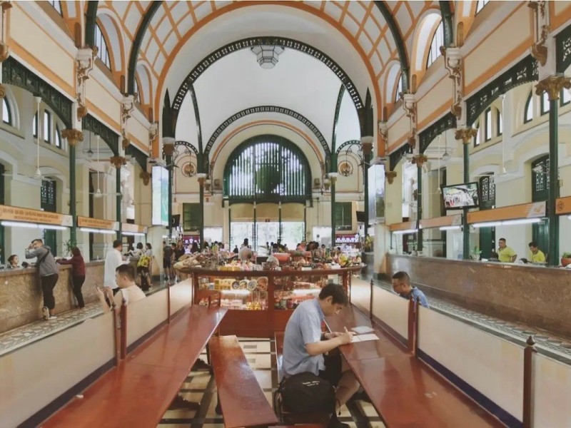Saigon Central Post Office Postal Services Area The postal services area inside Saigon Central Post Office with tourists buying souvenirs