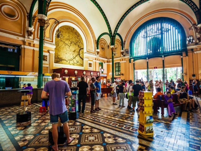 Saigon Central Post Office Visitors and Tourists Tourists and visitors inside Saigon Central Post Office admiring the historical interior