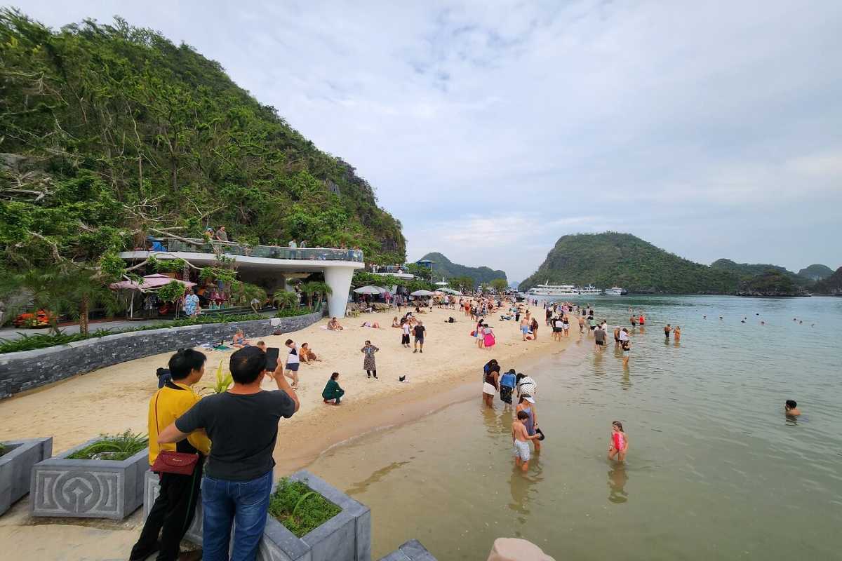 Soi Sim Island Halong Bay popular beach filled with visitors enjoying swimming and sunbathing